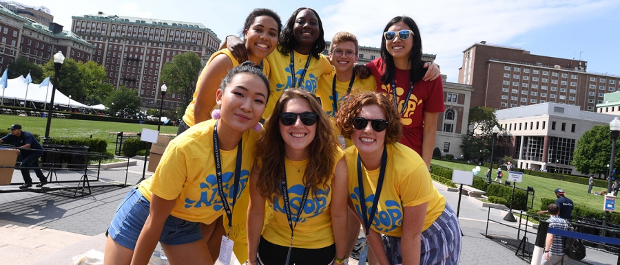 Orientation leaders pose near the sundial at move-in